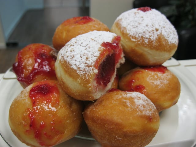 Sufganiyot/doughnuts filled with strawberry jelly