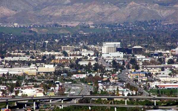 San Bernardino with downtown in the background and the I-215 freeway in the foreground.