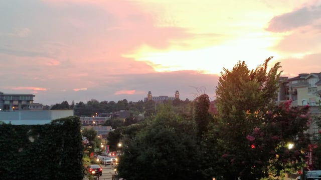 Sunset seen from Dickson Street, with Old Main on the horizon