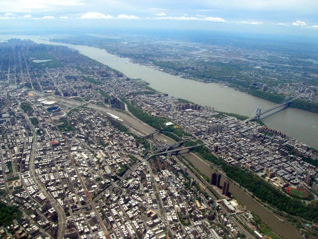 An aerial view of the Bronx, Harlem River, Harlem, Hudson River, and George Washington Bridge