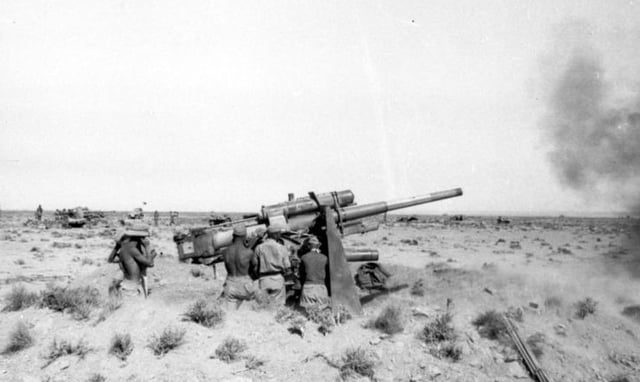 8.8 cm (3 in) Flak 18 guns fire upon British armour
