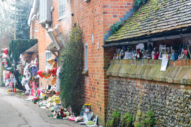 Tributes are seen surrounding Michael's home in Goring-on-Thames, South Oxfordshire