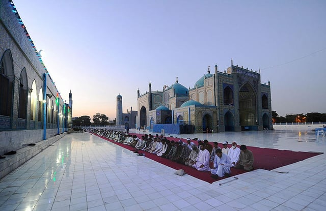 Men praying during Ramadan at the Shrine of Ali or "Blue Mosque" in Mazar-i-Sharif, Afghanistan