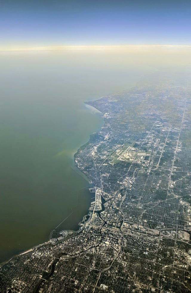 Aerial view from the north – the Menomonee River, Kinnickinnic River, and Milwaukee River are visible in the foreground; Wind Point in the background.