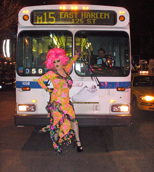 Miss Understood stops a M15 bus in front of the Lucky Cheng's restaurant at 2nd Street on First Avenue.