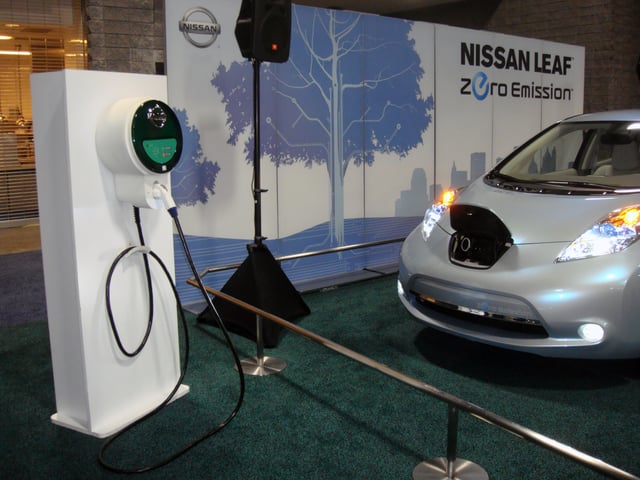 Nissan Leaf with Level 2 recharging station unit displayed at the 2010 Washington Auto Show