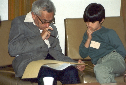 Paul Erdős teaching Terence Tao in 1985 at the University of Adelaide. Tao, who was 10 years old at the time, became a professional mathematician. He received the Fields Medal in 2006 and was elected a Fellow of the Royal Society in 2007. Tao has an Erdős number of 2.