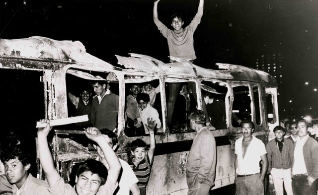Students in a burned bus during the protests of 1968