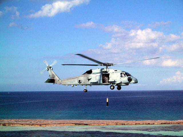 An MH-60R Seahawk conducts sonar operations.