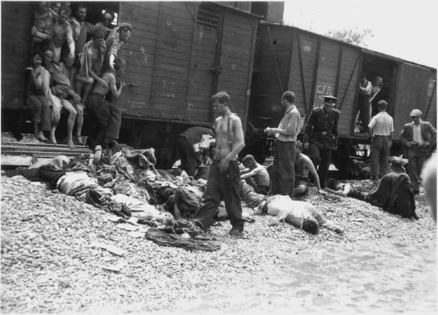 Pulling dead Jews from a CFR Holocaust death train in Romania after traveling 7 days, July 1941.