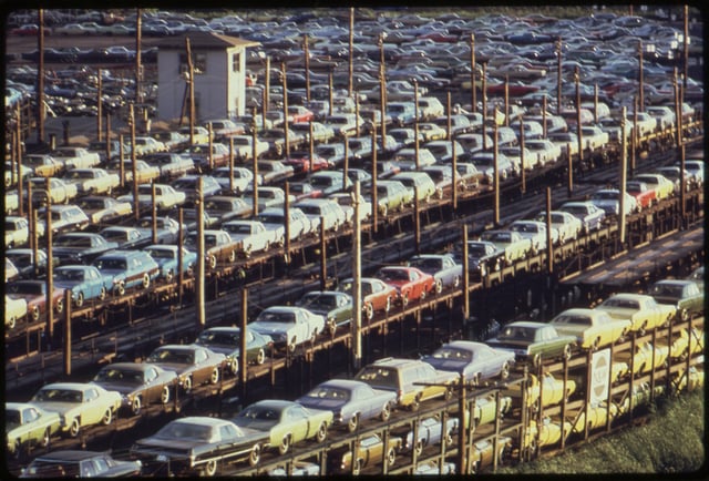 New cars built in Detroit loaded for rail transport, 1973