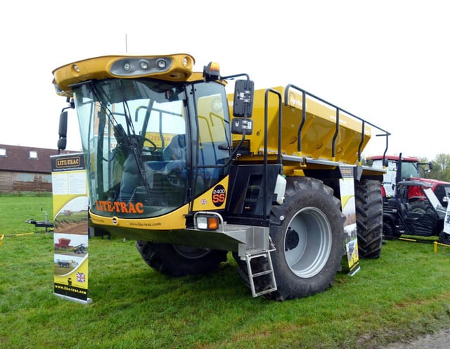 A Lite-Trac Agri-Spread lime and fertilizer spreader at an agricultural show