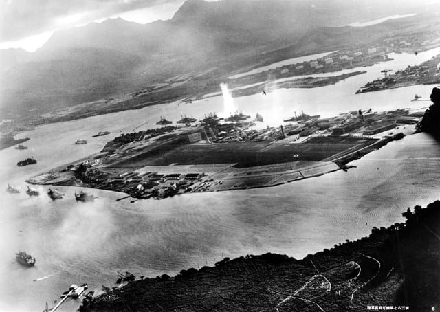 A view of the attack on Pearl Harbor in 1941 from Japanese planes. The torpedo explosion in the center is on the USS West Virginia.