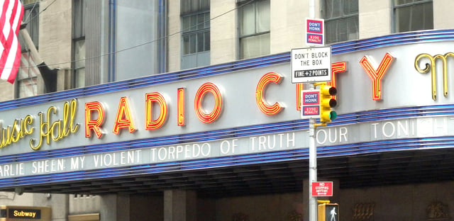 Sheen's "My Violent Torpedo of Truth/Defeat is Not An Option" tour on the marquee of Radio City Music Hall in New York City.