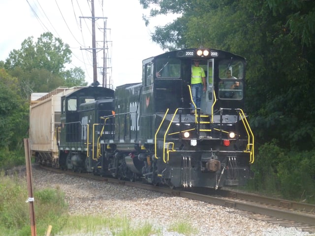 Knoxville and Holston River Railroad MP15AC #2002 leads a train through Tyson Park near downtown Knoxville.