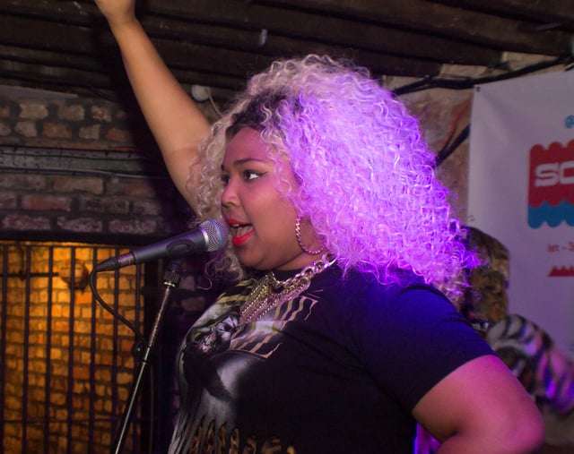Lizzo performing in 2014