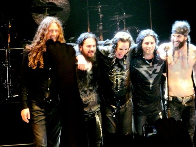 Osbourne (centre) and his touring band in 2011