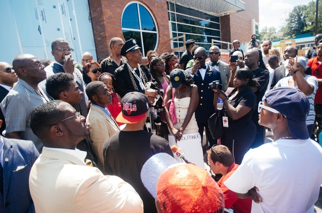Protesters gather at the Ferguson police department