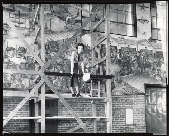 Aline Hofheimer (1909–1963) painting a 126-foot fresco representing aviation history in Roosevelt Field, Long Island (c. 1935)