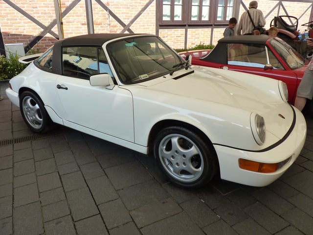 Porsche 911 (964), introduced in 1989, was the first to be offered with Porsche's Tiptronic transmission and four-wheel drive.