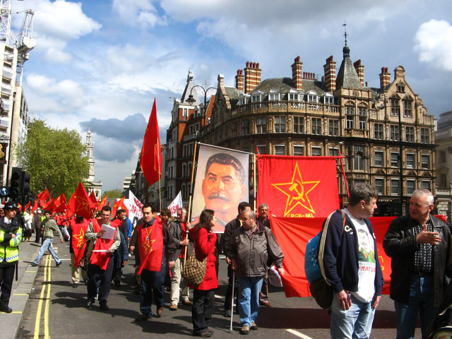 A contingent from the Communist Party of Great Britain (Marxist–Leninist) carrying a banner of Stalin at a May Day march through London in 2008.