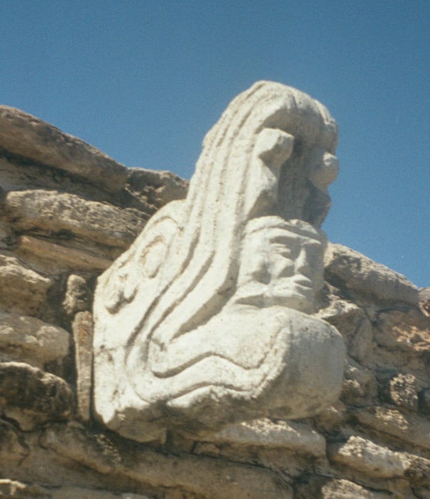 Ballcourt marker from the Postclassic site of Mixco Viejo in Guatemala. This sculpture depicts Kukulkan, jaws agape, with the head of a human warrior emerging from his maw.