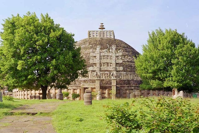 The stupa, which contained the relics of Buddha, at the center of the Sanchi complex was originally built by the Maurya Empire, but the balustrade around it is Sunga, and the decorative gateways are from the later Satavahana period.