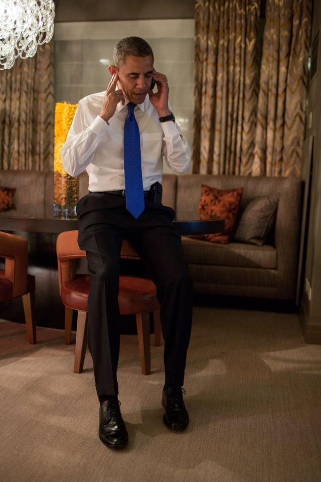 Obama takes a phone call from Romney conceding the election early Wednesday morning in Chicago.