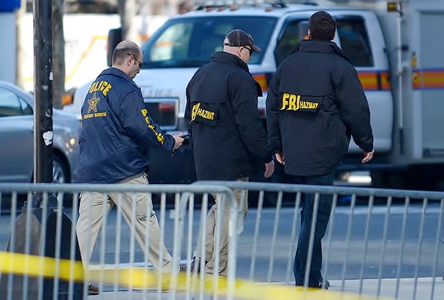 Secret Service and FBI agents investigate the Boston Marathon bombing