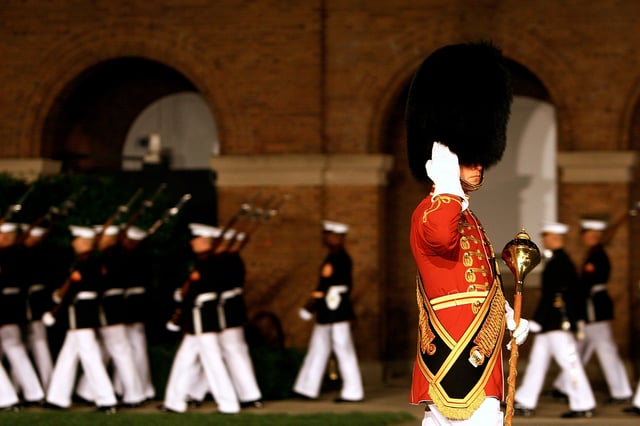 Gunnery Sergeant Duane King of the United States Marine Band salutes during a pass in review at the Friday Evening Parade at Marine Barracks Washington D.C.