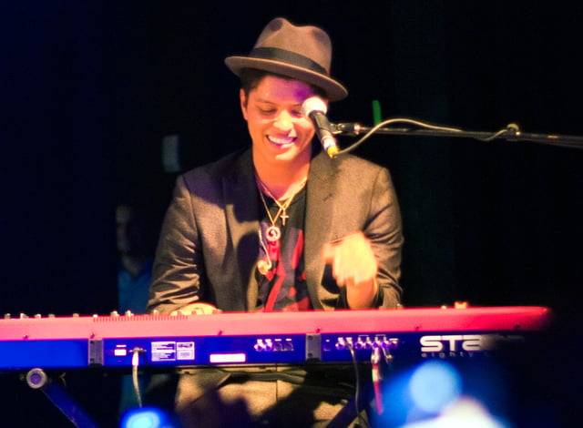Bruno Mars playing the keyboard in a concert in Houston, Texas in 2010.