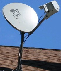 Satellite television dish on a residence