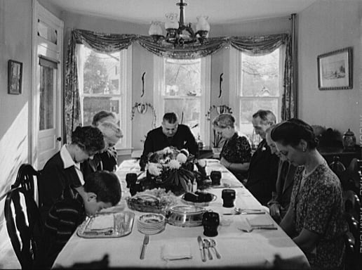 Family saying grace before Thanksgiving dinner in Neffsville, Pennsylvania, 1942