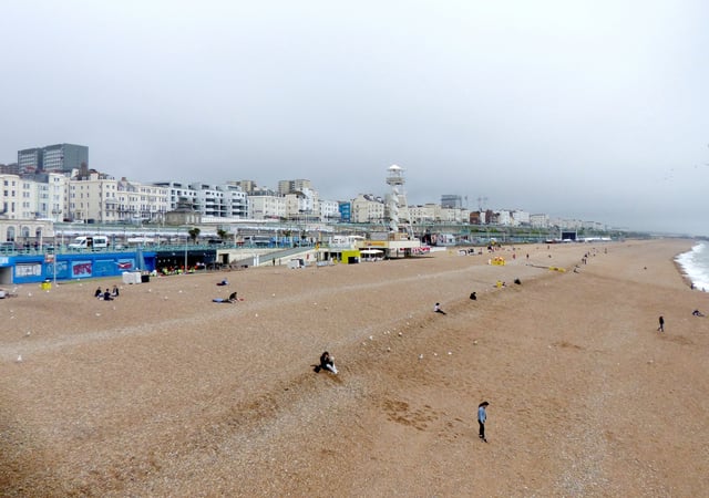 Brighton Beach, looking from the Palace Pier eastwards. The spiral tower is a Zip line ride. (June 2018)