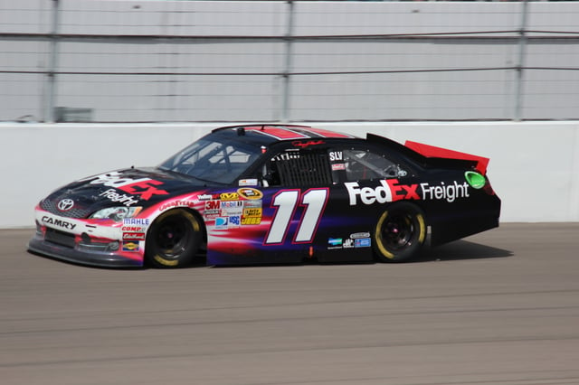 Denny Hamlin driving the FedEx-sponsored No. 11 car at the 2012 Kobalt Tools 400