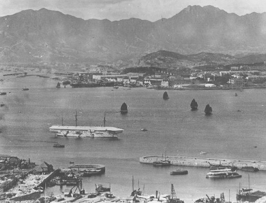 HMS Tamar (white vessel) anchored off the Naval Dockyard (1905)