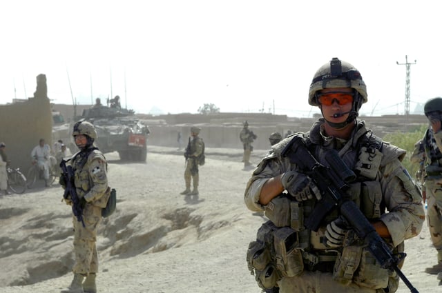 Canadian soldiers patrol Kandahar Afghanistan armed with C7 (M16 type) rifles