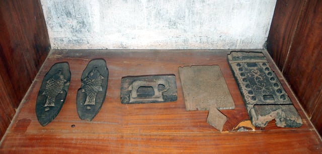 Ancient wooden molds used for jaggery & sweets, archaeological museum in Jaffna, Sri Lanka.