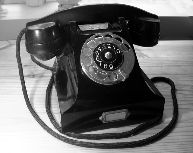 The Ericsson DBH1001 (1931) was the first combined telephone set with a housing and handset made from Bakelite. The design is attributed to Jean Heiberg.