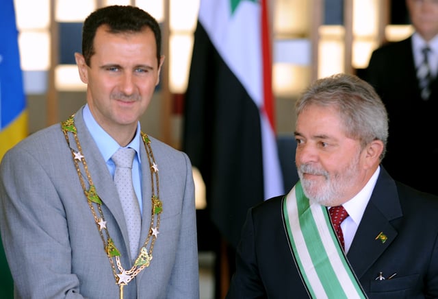 Bashar al-Assad wearing the "Grand Collar" of the National Order of the Southern Cross, accompanied by Brazilian President Luiz Inácio Lula da Silva in Brasília, 30 June 2010