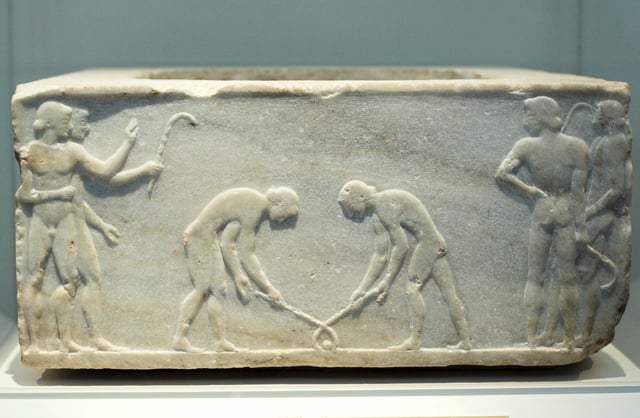 Relief of 510 BC depicting ancient Greek players of kerētízein, an ancestral form of hockey or ground billiards; in the National Archaeological Museum, Athens