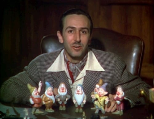 Walt Disney introduces each of the seven dwarfs in a scene from the original 1937 Snow White