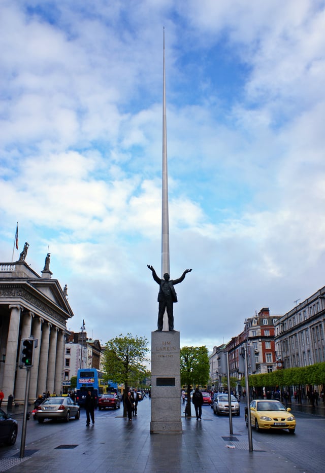 Spire of Dublin rises behind the statue of Jim Larkin