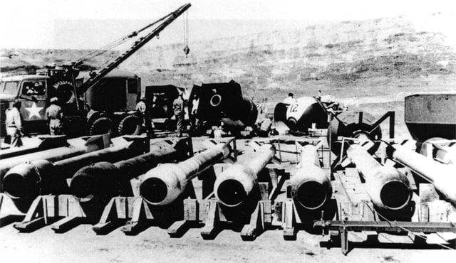 A row of Thin Man casings. Fat Man casings are visible in the background.