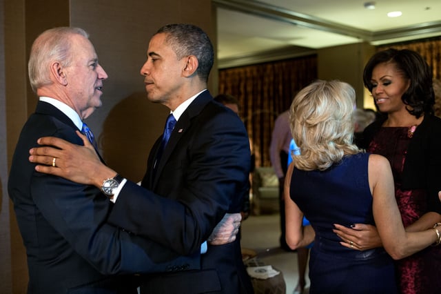 Obama (far right) celebrates with Jill Biden after their husbands win re-election.