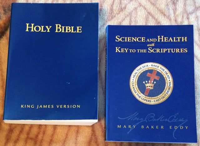 The Bible (left) and Science and Health with Key to the Scriptures (right) serve as the pastor of the Christian Science church.