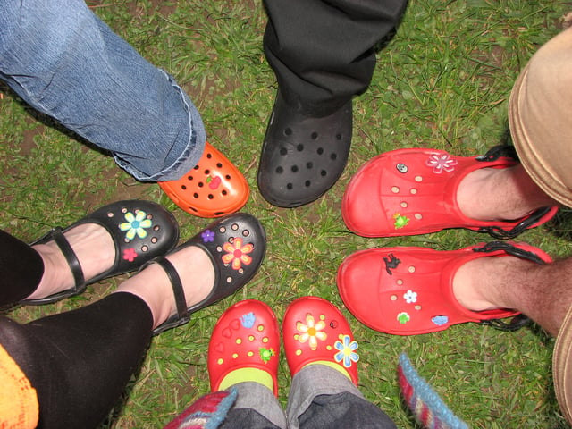 Various types of Crocs with accessories