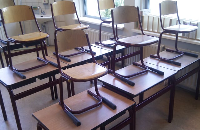 Classroom with chairs on desks in the Netherlands