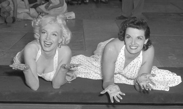 Monroe and co-star Jane Russell after pressing their hands in wet concrete at Grauman's Chinese Theater