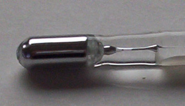The bulb of a mercury-in-glass thermometer